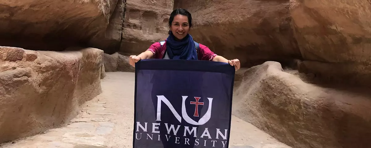 A Theology student represents Newman University during a guided trip to Petra, Jordan.