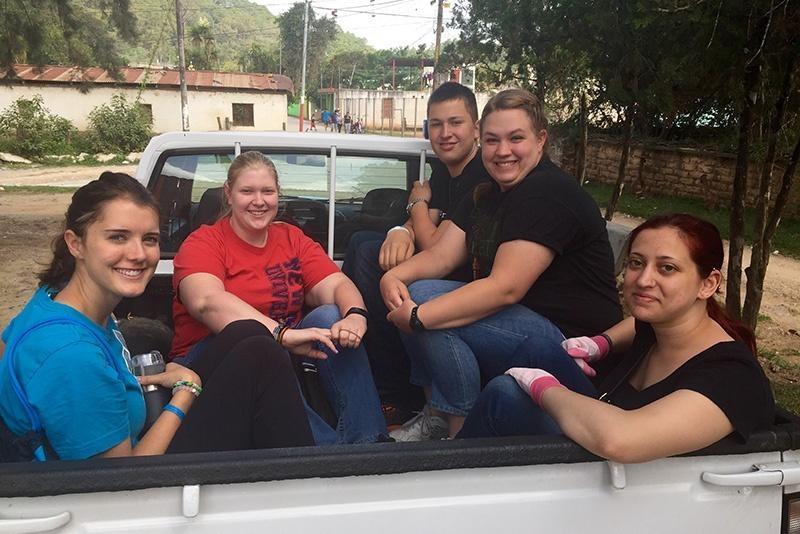 Students in the back of a truck in Guatemala.